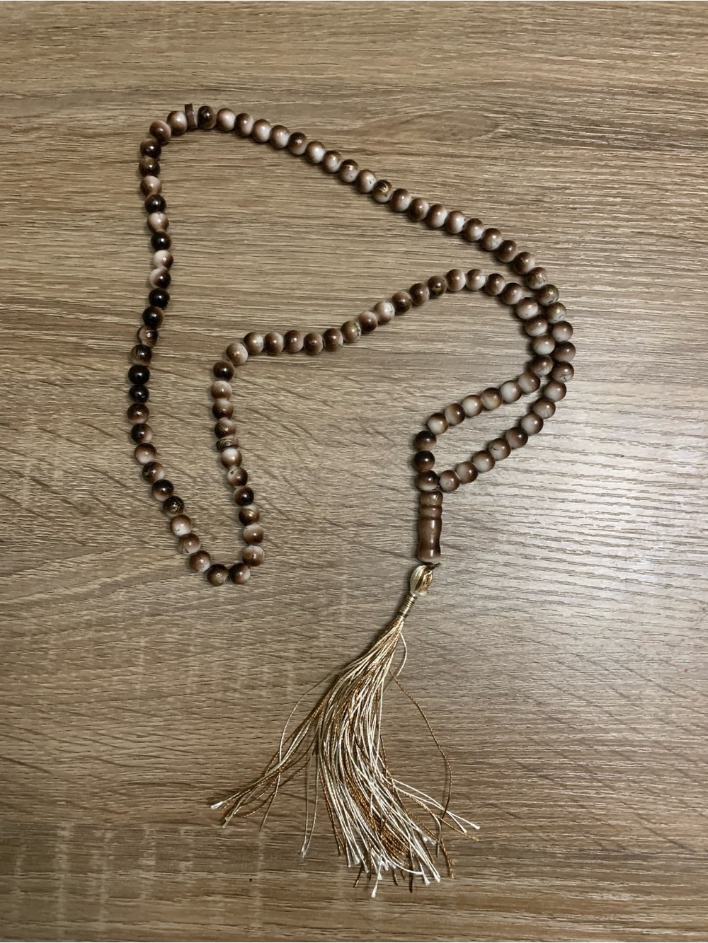 Handcrafted Brown Wood Bead Necklace with Gold Tassel